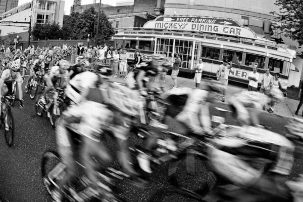 Riders pass by Mickey's Dining Car, a downtown St Paul icon.