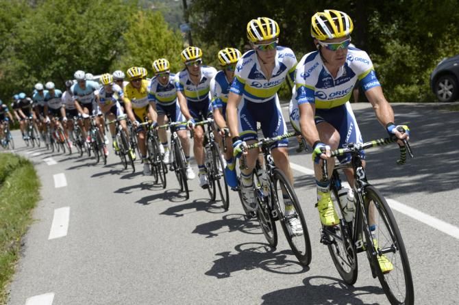 Stuart O'Grady rode his final Tour de France in 2013 as part of the Australian WorldTour squad Orica-GreenEdge. O'Grady sets tempo at the head of the peloton while compatriot Simon Gerrans holds the yellow jersey