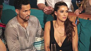 Bachelor in Paradise Becca Kufrin sits by Thomas Jacobs