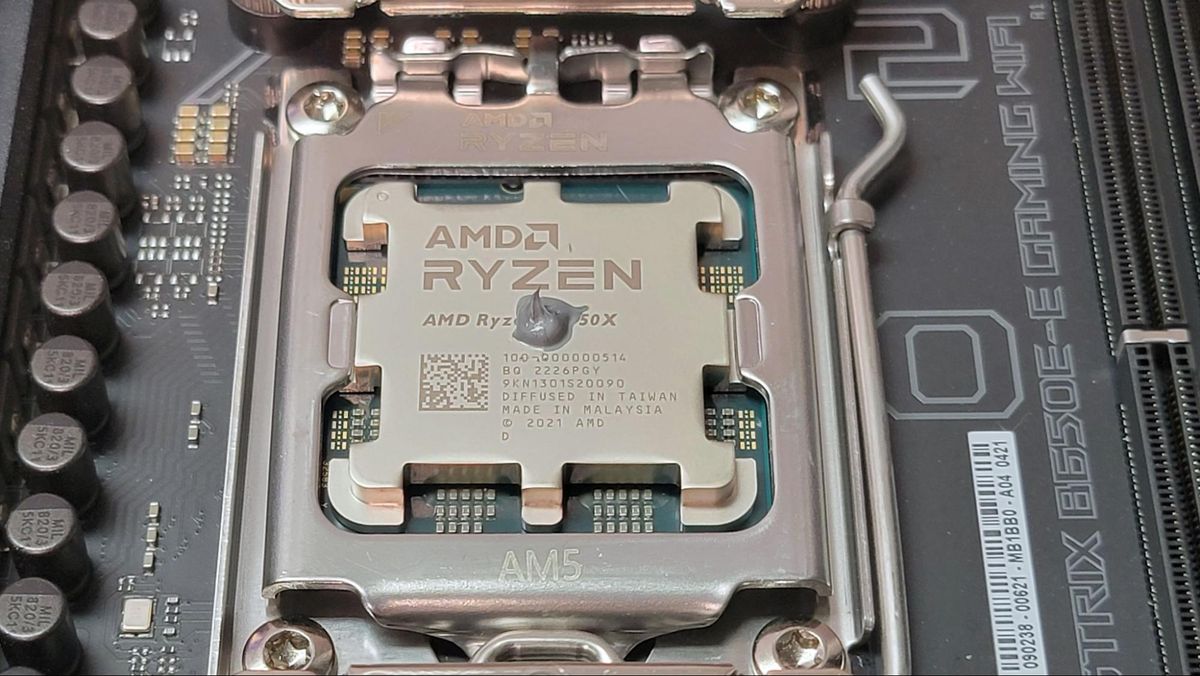 A small drop of thermal paste on an AMD CPU