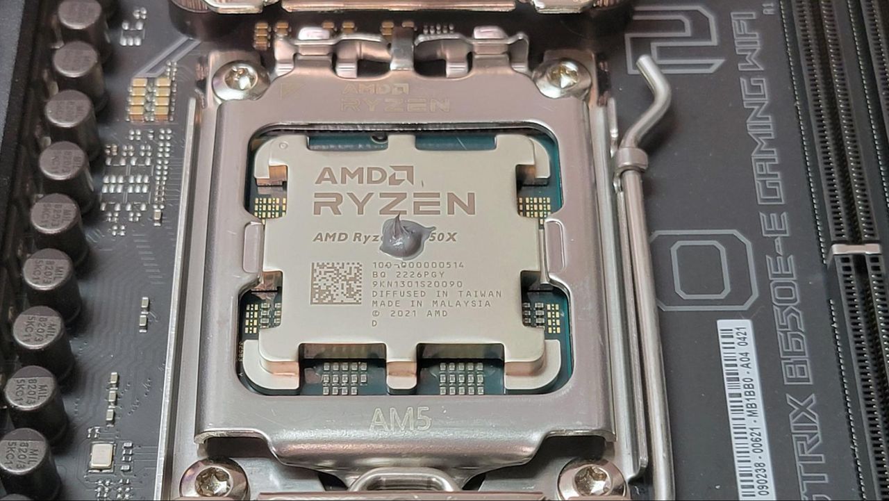 A small drop of thermal paste on an AMD CPU