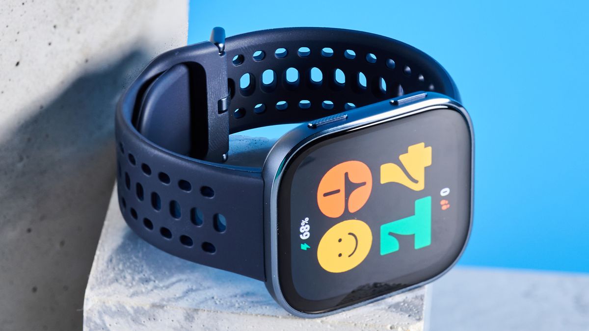 The Amazfit Bip 6 smartwatch photographed in front of a blue background