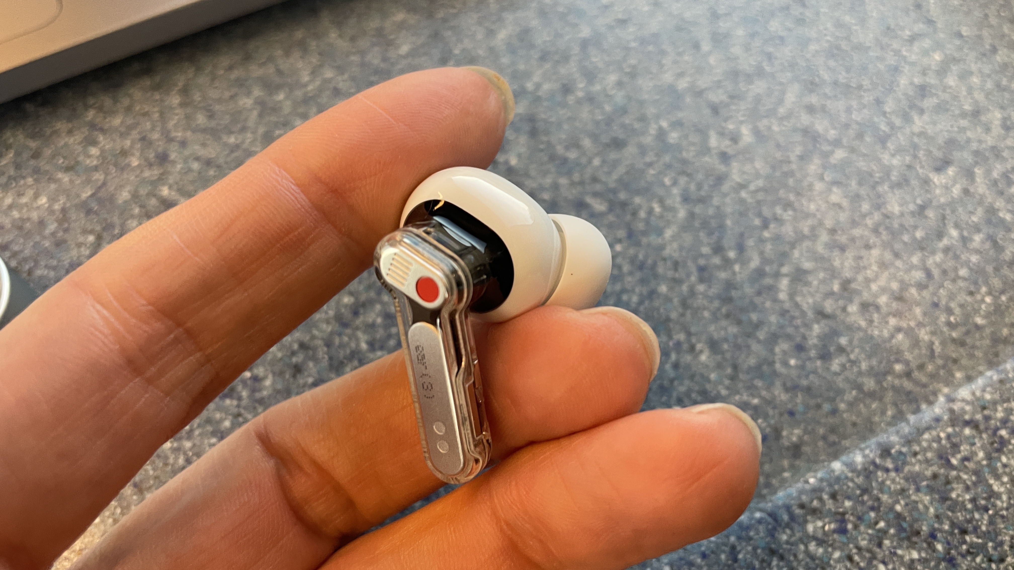 Nothing Ear (3) being tested on a commuter train late at night