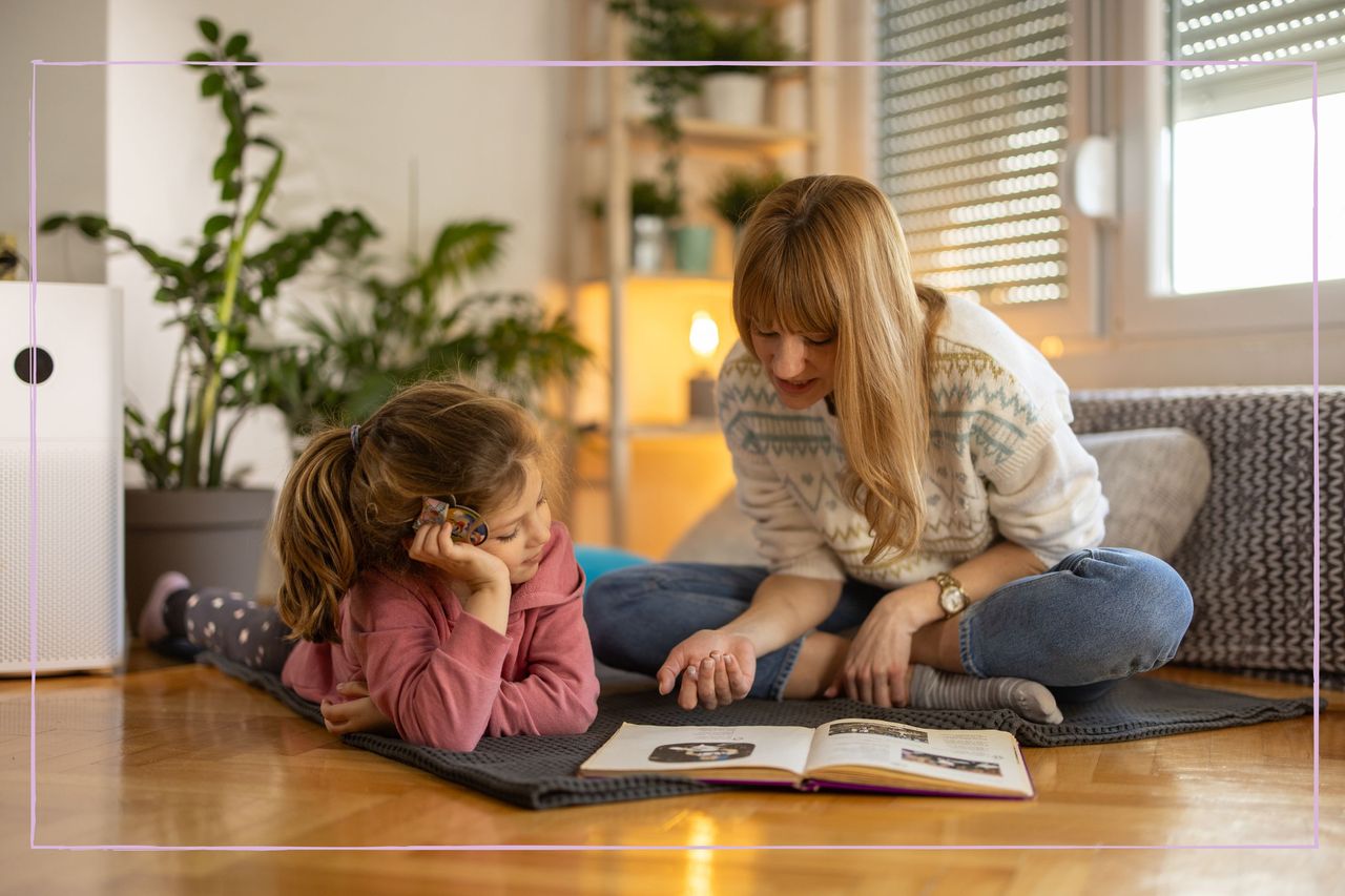 parent teaching their child to read