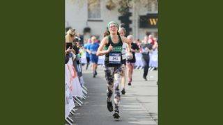 Kate Dunbar running towards the photographer at a half-marathon race