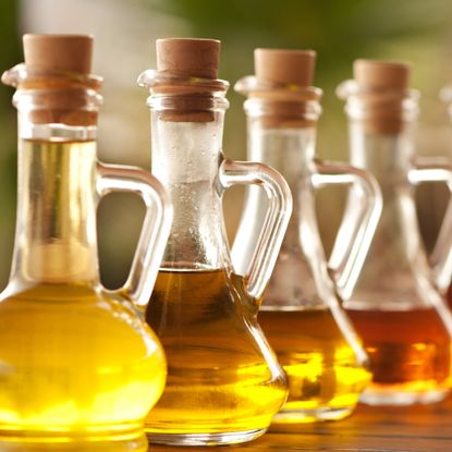 Row of bottles of oils and vinegars