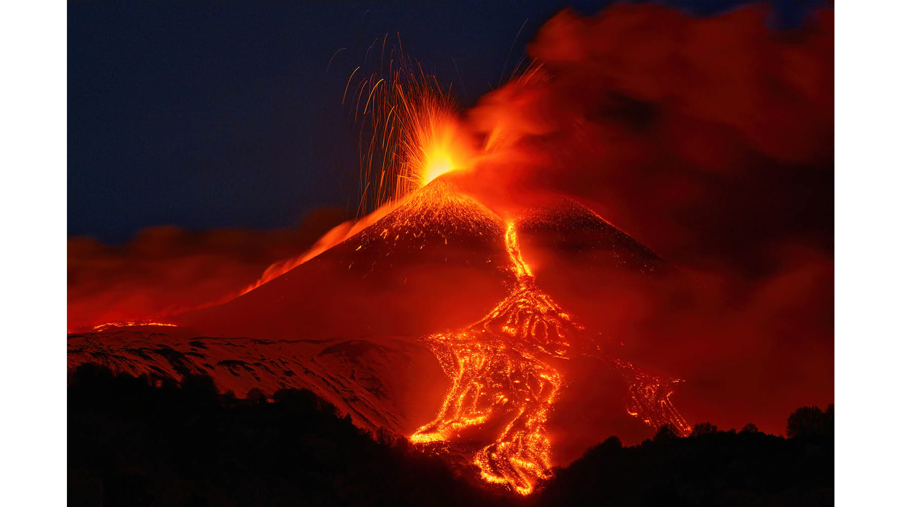 Photograph titled Edna&#039;s Paroxysm, taken by Gianluca Gianferrari and the Grand Prize winner of the Hamdan bin Mohammed bin Rashid Al Maktoum International Photography Award (HIPA) 2025. Description reads: Above Sicily&#039;s Etna Volcano, glowing lapilli erupt against a snowy backdrop, and thus creating a striking contrast. The fiery bursts settle on fresh snow, forming a kaleidoscope of colors under the night sky. This is a testament to the unpredictable beauty of nature, where destructive power merges with serenity in a fleeting embrace that is eternally captured by the lens of the camera.