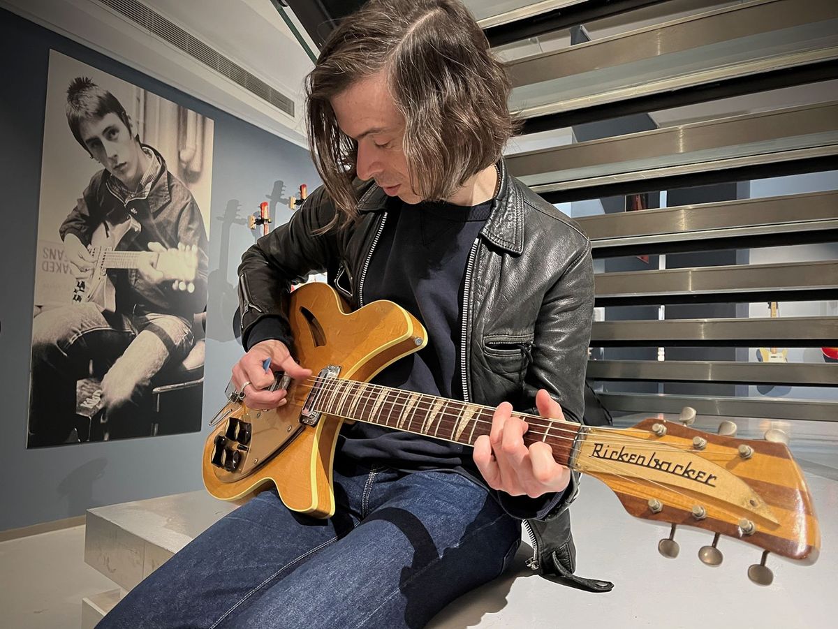 Little Barrie playing a Rickenbacker at Rickenbacker exhibition at Shapero Rare Books in New Bond Street, London, 2022
