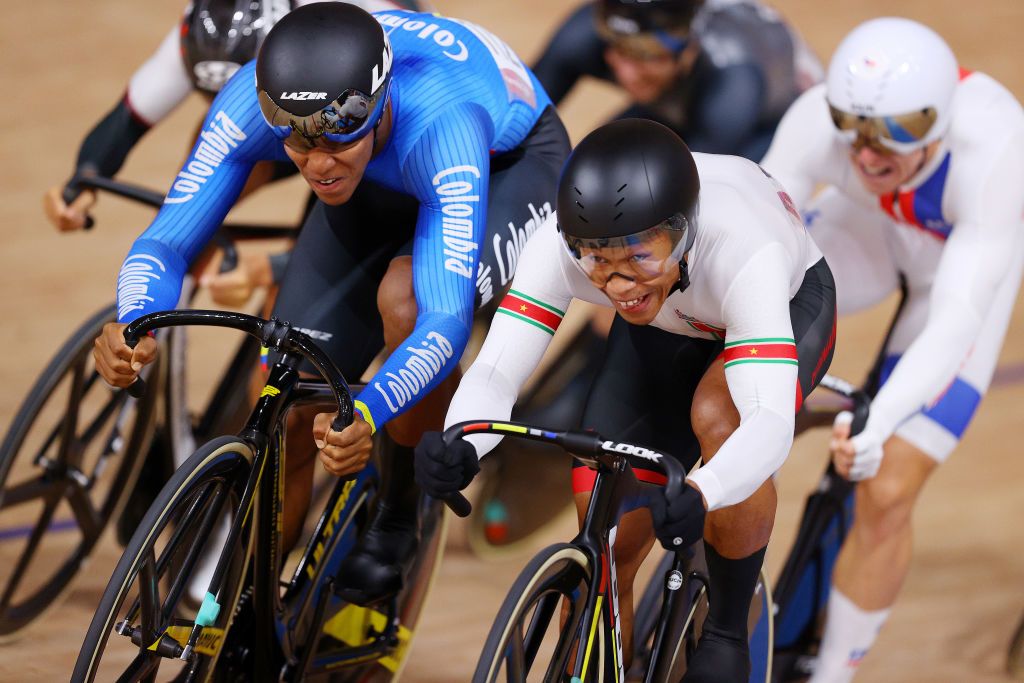 IZU JAPAN AUGUST 07 LR Kevin Santiago Quintero Chavarro of Team Colombia and Jair Tjon En Fa of Team Suriname sprint during the Mens Keirin first round heat 5 of the track cycling on day filthen of the Tokyo 2020 Olympic Games at Izu Velodrome on August 07 2021 in Izu Shizuoka Japan Photo by Tim de WaeleGetty Images