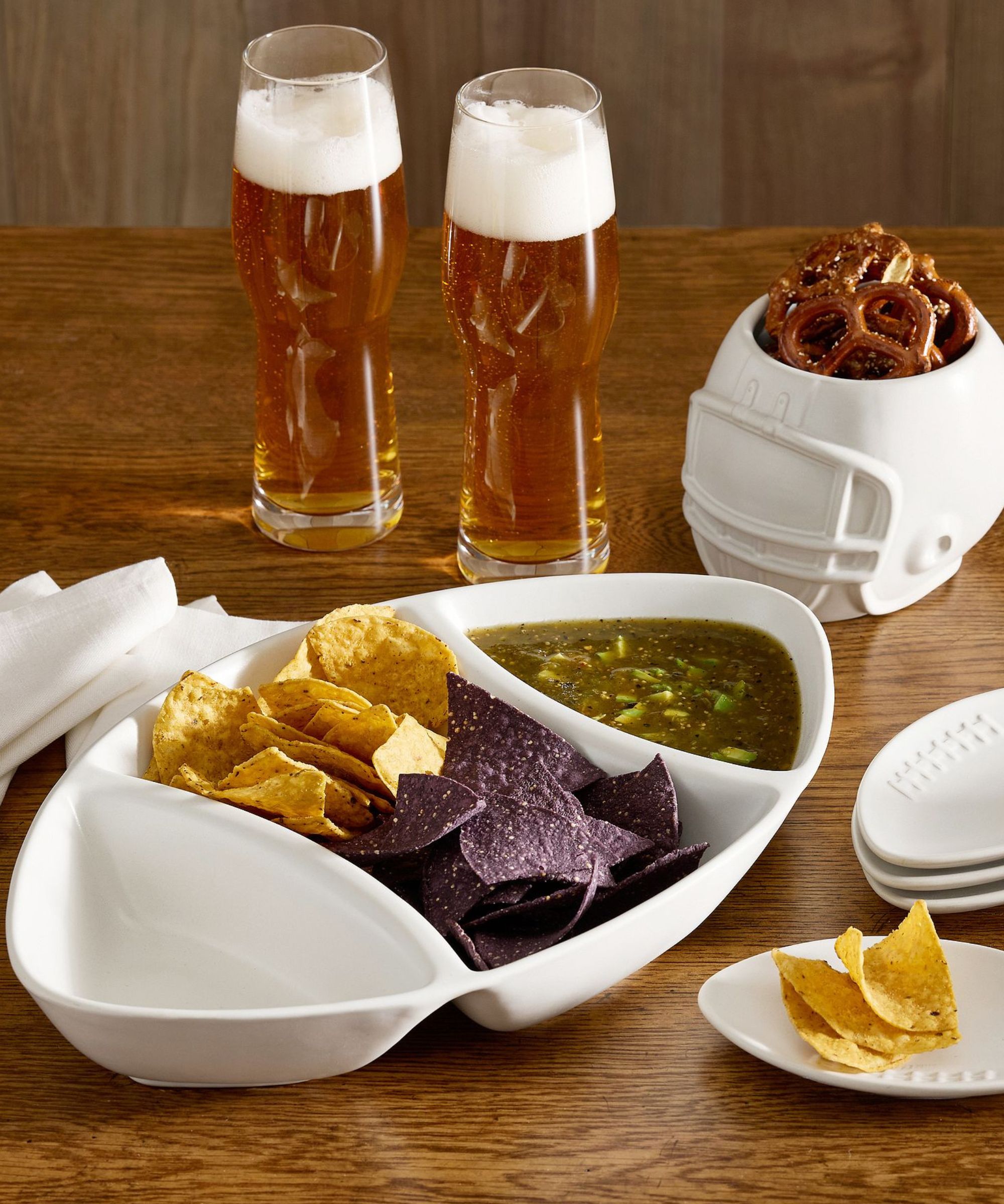 Football-shaped chip and dip with football-shaped side plate and a helmet-shaped snack bowl