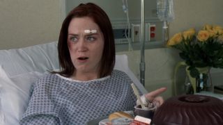 Emily eating pudding in the hospital