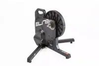 Elite Suito smart turbo trainer is a direct drive. This image show's the trainer front side on, with the three legs to stabilise the flywheel and cassette on display.   