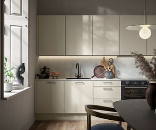 Minimalist kitchen with taupe kitchen cabinets and a dark wood dining table