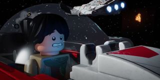 A Lego Star Wars minifig character inside a spaceship