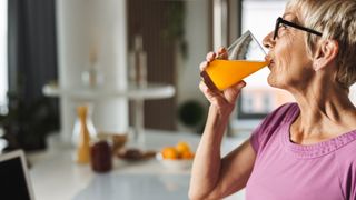 Woman drinking water with electrolytes