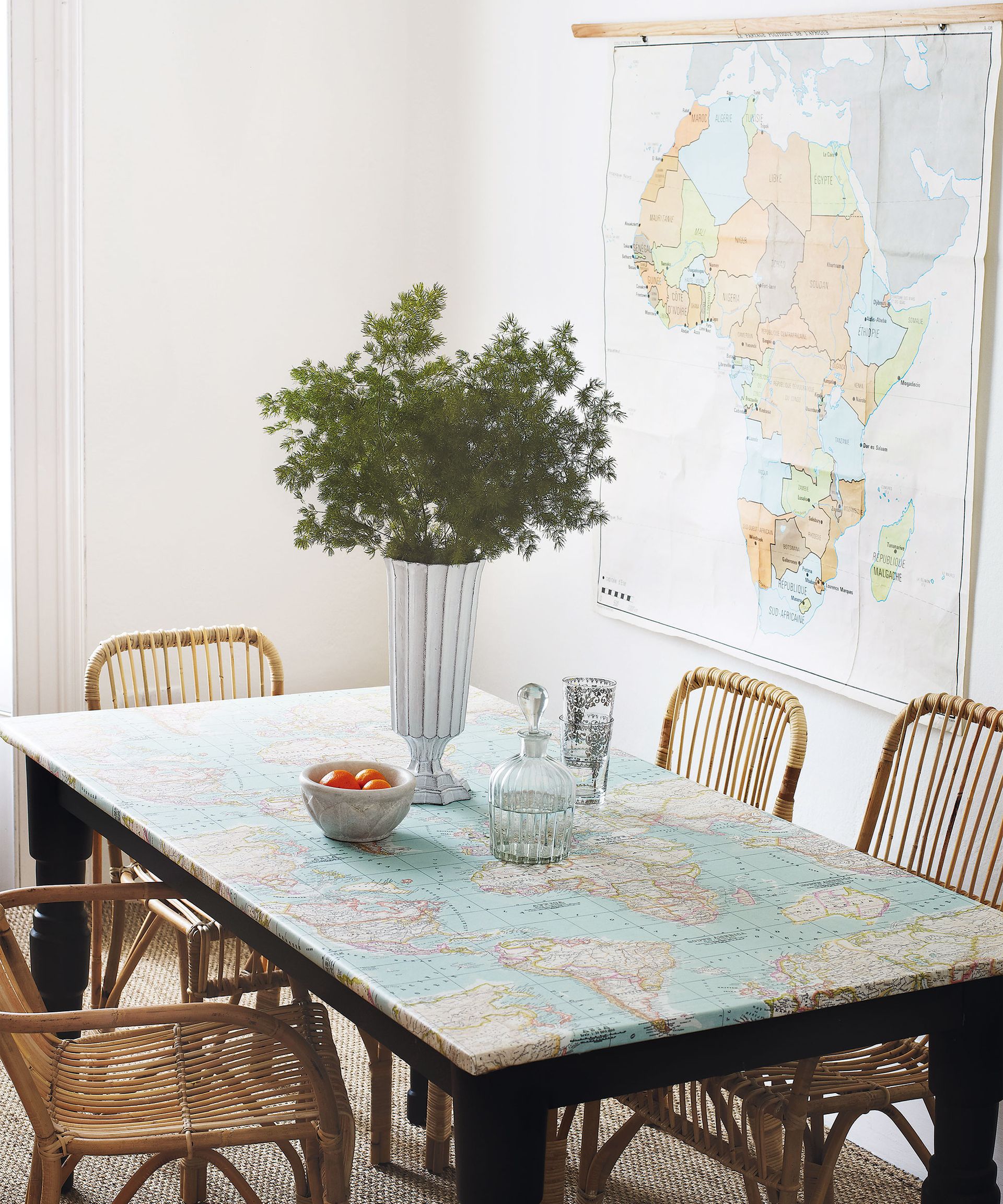 Dining room with map on the wall and table