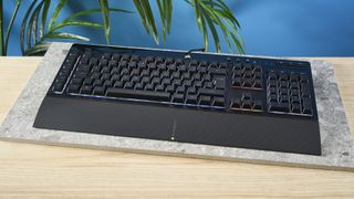 A black Corsair K55 RGB Pro wired gaming keyboard with rubber dome switches