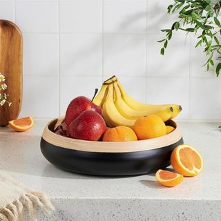 A black and bamboo fruit bowl