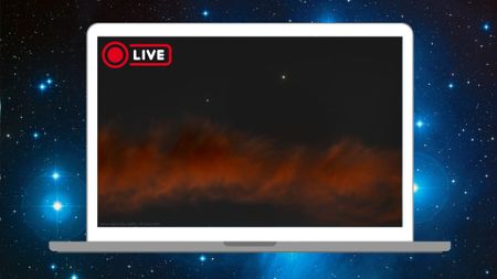Two bright planets are shown shining side by side in the night sky above a red cloud on a laptop floating against a deep space background dotted with blue-white stars. 