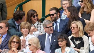 Benedict Cumberbatch, Sophie Hunter, Bradley Cooper and Irina Shayk having a discussion in the crown at Wimbledon
