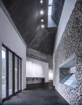 Stone and white plaster surfaces inside rural Chinese museum