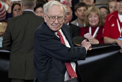 Warren Buffett, chairman emeritus of Berkshire Hathaway Inc., plays table tennis on the sidelines the Berkshire Hathaway annual shareholders meeting in Omaha, Nebraska, U.S., on Sunday, May 1, 2016.