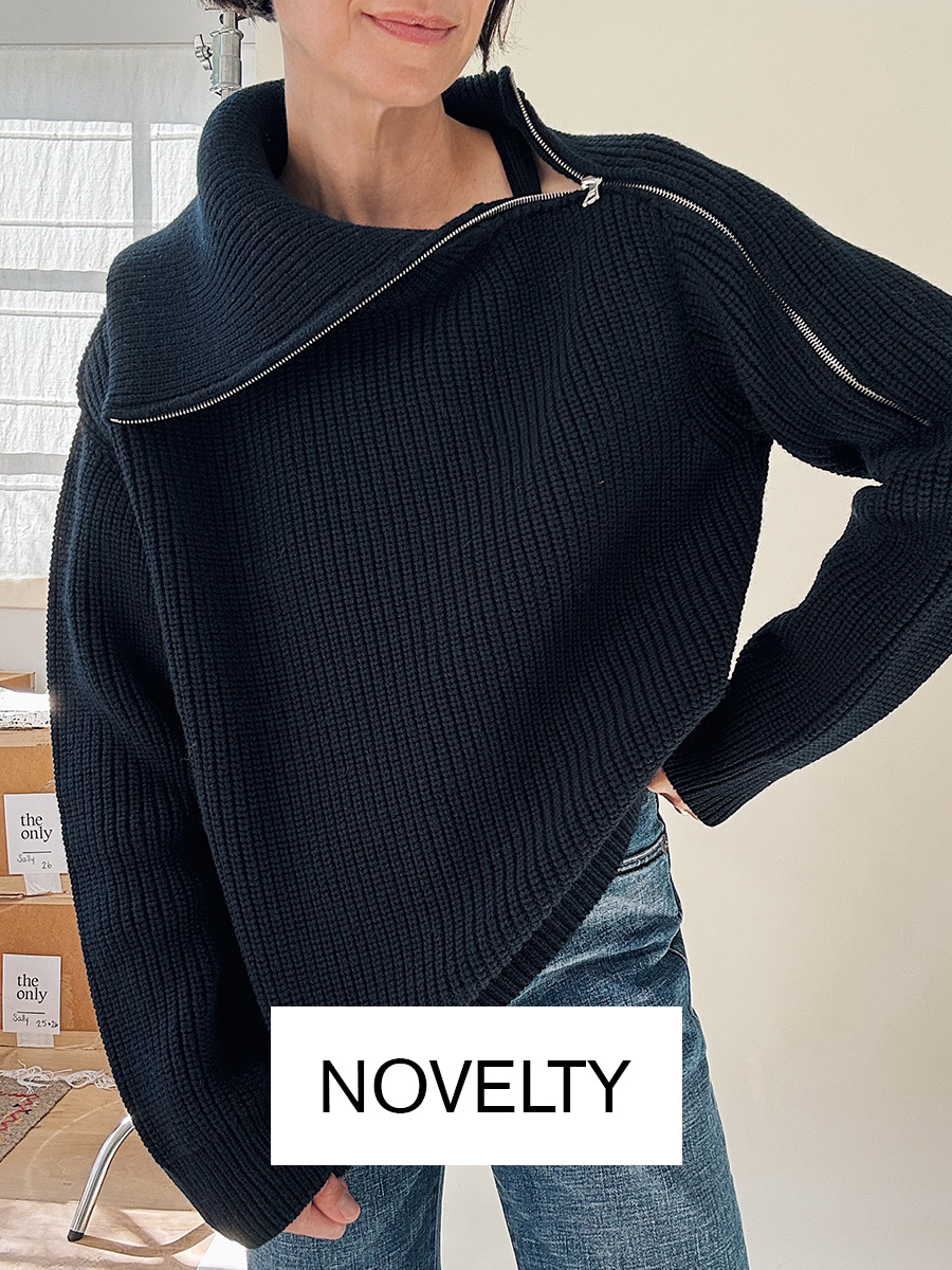 Jane Herman in chic navy sweater and jeans