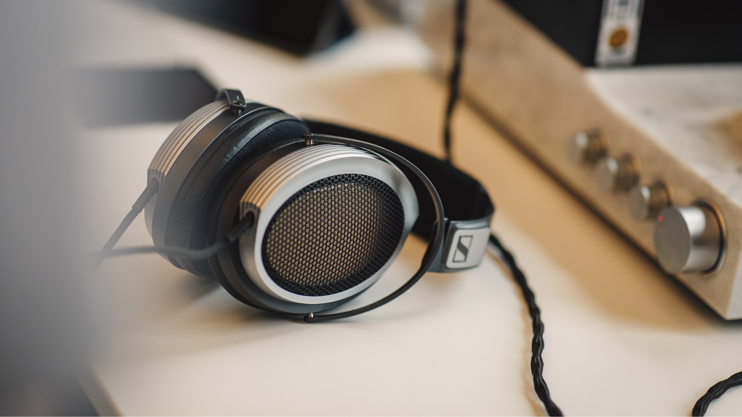 Sennheiser HE 1 wired headphones on a desk