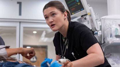 Santos performs surgery on a patient