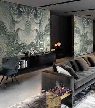 a living room with a marble feature wall by Cullifords