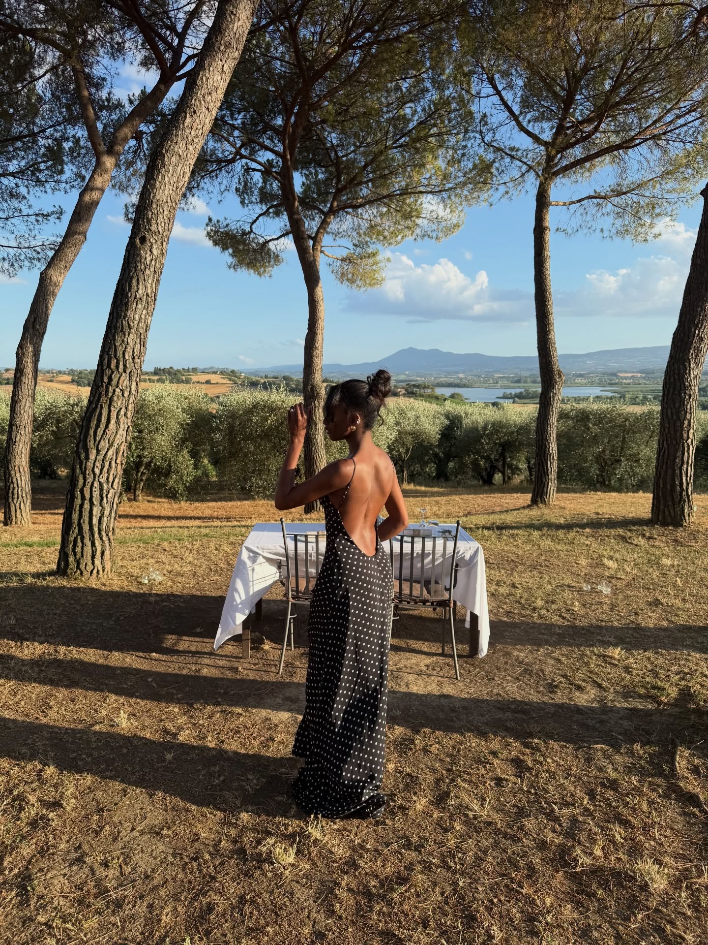 Liv Madeline wears a polka dot maxi dress in the south of france.