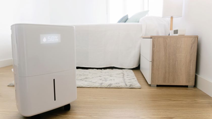 Dehumidifier in a bedroom with a 50% humidity level