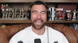 Travis Kelce smiles on New Heights.