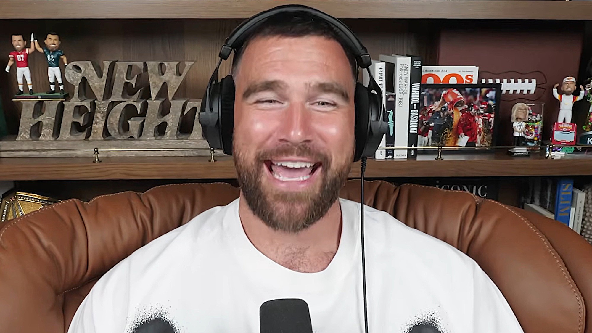 Travis Kelce smiles on New Heights.