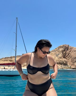 Woman wearing black bikini.