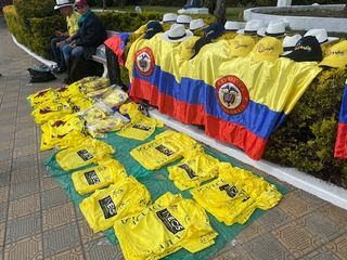 Vendors at Tour Colombia 2.1 sell replicas of Egan Bernal's Tour de France yellow jersey