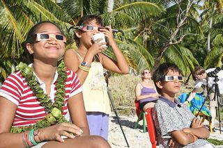 uring the July 11, 2010, total solar eclipse, veteran eclipse chasers Imelda Joson and Edwin Aguirre distributed eclipse glasses to residents of Tatakoto Atoll in French Polynesia so they could safely enjoy the celestial show.
