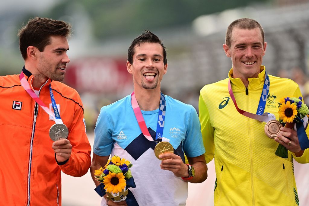 LR Silver medalist Netherlands Tom Dumoulin gold medalist Slovenias Primoz Roglic and bronze medalist Australias Dennis Rohan pose on the podium after the mens cycling road individual time trial during the Tokyo 2020 Olympic Games at the Fuji International Speedway in Oyama Japan on July 28 2021 Photo by Ina FASSBENDER AFP Photo by INA FASSBENDERAFP via Getty Images
