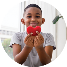 Child holding love heart