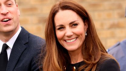 Britain's Prince William, Duke of Cambridge, and Britain's Catherine, Duchess of Cambridge, wearing black as a mark of respect following the death of Britain's Prince Philip, Duke of Edinburgh, talk with Air Cadets during their visit to 282 (East Ham) Squadron Air Training Corps in east London on April 21, 2021. - During the visit, the Squadron paid tribute to The Duke of Edinburgh, who served as Air Commodore-in-Chief of the Air Training Corps for 63 years. In 2015, The Duke passed the military patronage to The Duchess of Cambridge who became Honorary Air Commandant. (Photo by Ian Vogler / POOL / AFP) (Photo by IAN VOGLER/POOL/AFP via Getty Images)