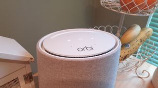 Volume control and buttons appear when you place your hand above the Orbi Voice