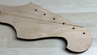 a laser cut plywood template, made with an Alto Delta