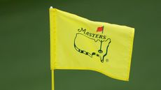 A flag with the Masters logo on it