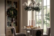 a dining room decorated for christmas