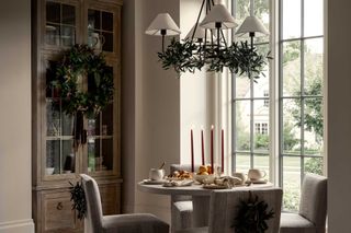 a dining room decorated for christmas