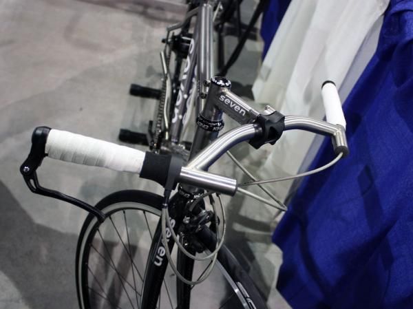 Internally routed brake cables exit out through the titanium Seven H-bars.