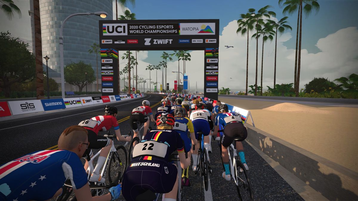 The riders head towards the finish area after the first lap of racing