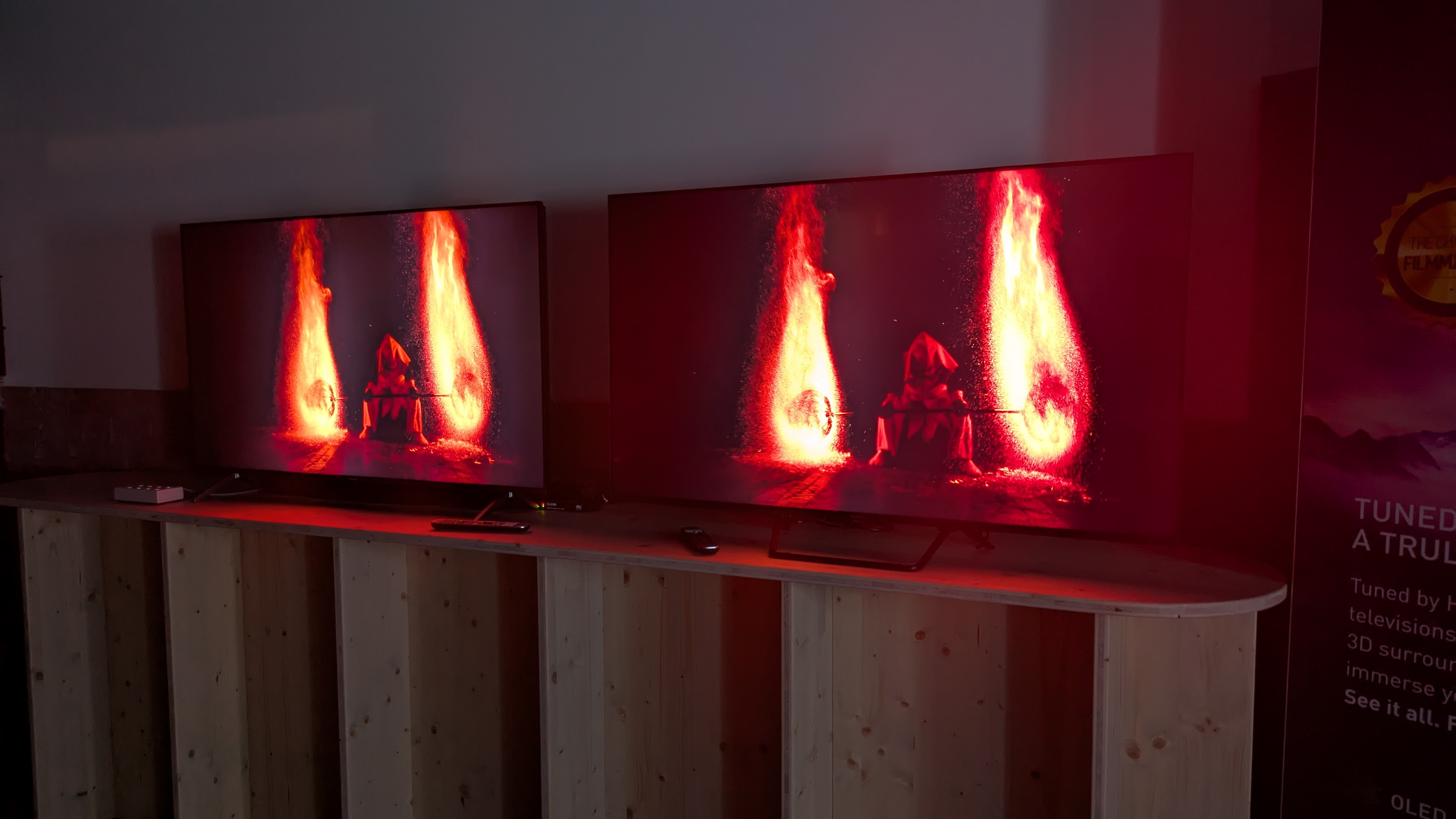 Panasonic W95A on left and Panasonic W95B on right showing fire artist on screen