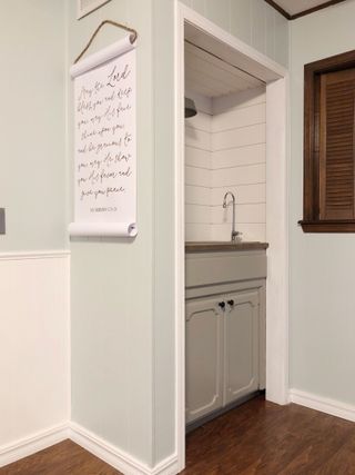 Coffee nook with decorative writing on kitchen wall
