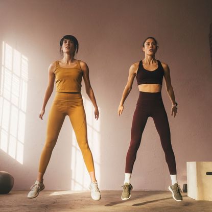 Two women trying a jump training workout